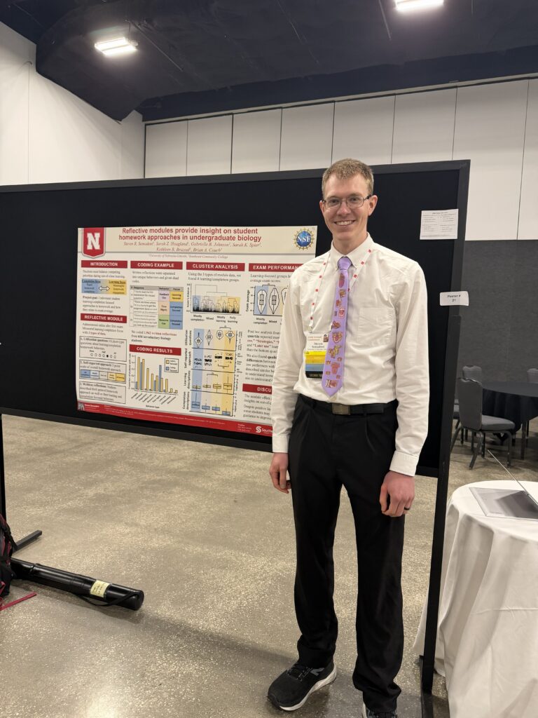 Presenter in front of their poster