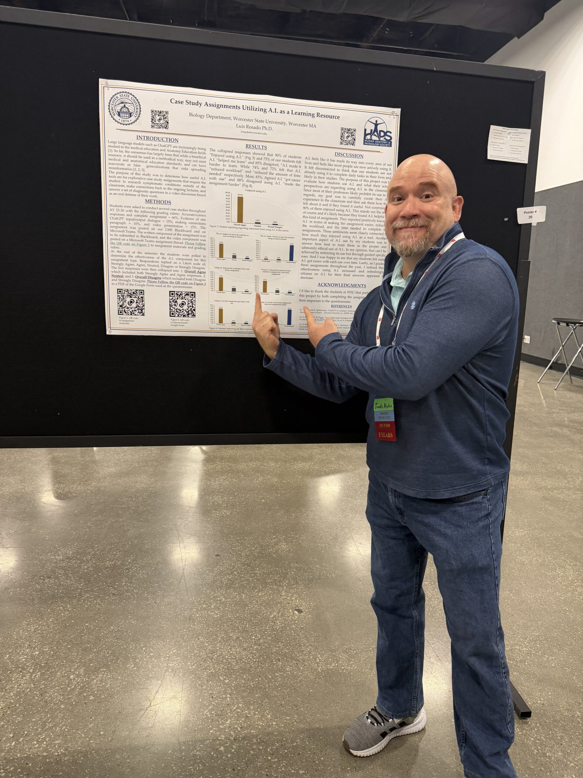 Presenter in front of their poster
